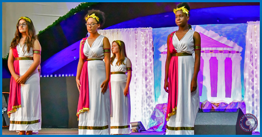 Plato students dressed in ancient Greek gowns during the performance.