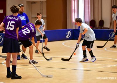 Plato Academy Students playing hockey