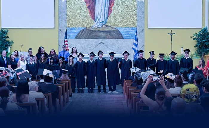 Eighth grade graduates at Plato Academy Pinellas Park standing on stage at their 2026 graduation ceremony with teachers and staff, representing school community, charter school education, and student achievement in Pinellas County, Florida.